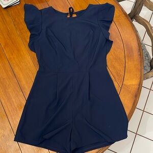 Runaway Story Ruffled Romper with backless slit and tie